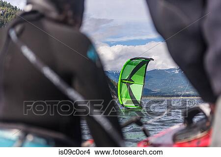 People kite surfing in sea View Large Photo Image Picture - People kite surfing in sea. Fotosearch