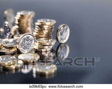 Pile of new British one pound coins, close-up View Large Photo Image Picture - Pile of new British one pound coins, close-up. Fotosearch