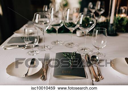 Place setting at wedding reception table with cutlery, menu and drinking glasses View Large Photo Image Stock Photo - Place setting at wedding reception table with cutlery, menu and drinking glasses. Fotosearch