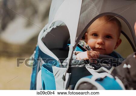 Portrait of baby in carrier View Large Photo Image Picture - Portrait of baby in carrier. Fotosearch