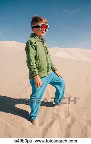 Portrait of boy on sand dunes, wearing goggles, Eureka Dunes, Death Valley National Park, California, USA View Large Photo Image Stock Photograph - Portrait of boy on sand dunes, wearing goggles, Eureka Dunes, Death Valley National Park, California, USA. Fotosearch