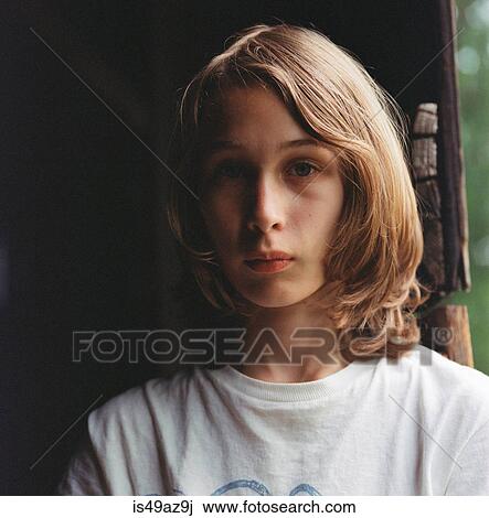Portrait of boy with long hair, pensive expression View Large Photo Image Stock Image - Portrait of boy with long hair, pensive expression. Fotosearch
