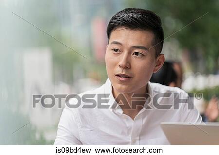 Stock Photo - Portrait of businessman, outdoors. Fotosearch