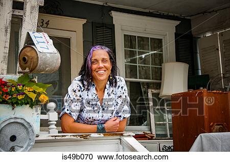 Portrait of female shop keeper in front porch shabby chic shop View Large Photo Image Stock Image - Portrait of female shop keeper in front porch shabby chic shop. Fotosearch
