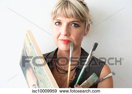 Portrait of fine art painter with painting and paint brushes View Large Photo Image Stock Photo - Portrait of fine art painter with painting and paint brushes. Fotosearch