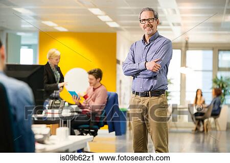 Portrait of mature male digital designer in office View Large Photo Image Stock Image - Portrait of mature male digital designer in office. Fotosearch