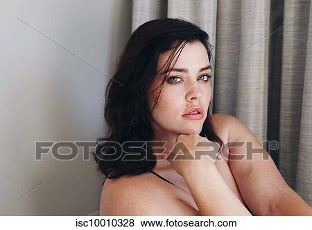 Stock Photo - Portrait of sultry woman. Fotosearch
