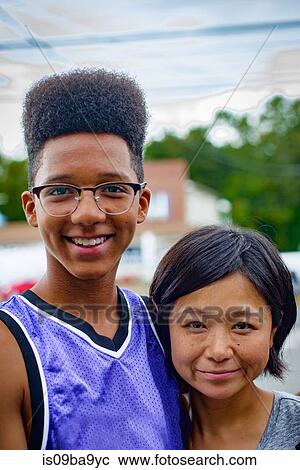 Portrait of teenage boy and mid adult woman on street View Large Photo Image Stock Image - Portrait of teenage boy and mid adult woman on street. Fotosearch