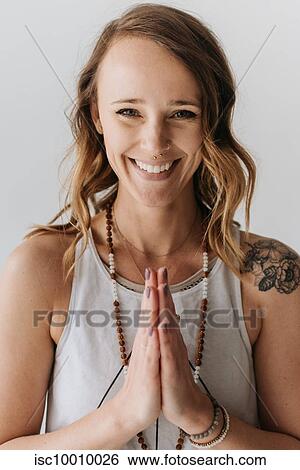 Portrait of woman in prayer pose View Large Photo Image Stock Photograph - Portrait of woman in prayer pose. Fotosearch