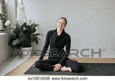 Stock Photo - Portrait of woman in yoga studio. Fotosearch