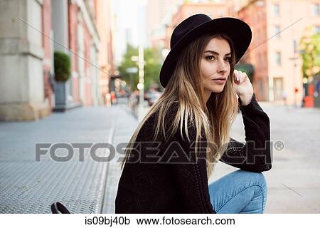 Portrait of woman wearing hat looking away, New York, USA View Large Photo Image Stock Image - Portrait of woman wearing hat looking away, New York, USA. Fotosearch