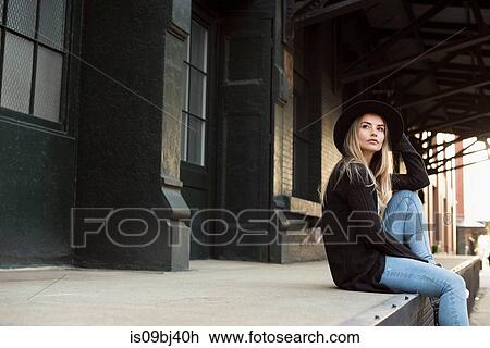 Portrait of woman wearing hat looking away, New York, USA View Large Photo Image Stock Image - Portrait of woman wearing hat looking away, New York, USA. Fotosearch