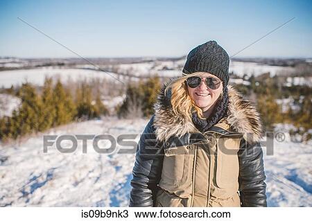 Portrait of young woman in snowy landscape View Large Photo Image Stock Image - Portrait of young woman in snowy landscape. Fotosearch