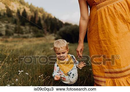 Stock Image - Pregnant mother with toddler daughter in rural valley, cropped, Mineral King, California, USA. Fotosearch
