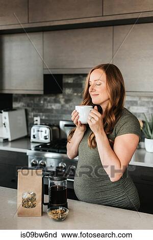 Pregnant woman brewing herbal tea with french press View Large Photo Image Stock Image - Pregnant woman brewing herbal tea with french press. Fotosearch