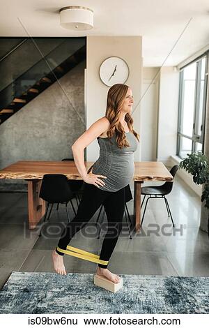 Pregnant woman doing balancing and strengthening exercise View Large Photo Image Stock Photograph - Pregnant woman doing balancing and strengthening exercise. Fotosearch