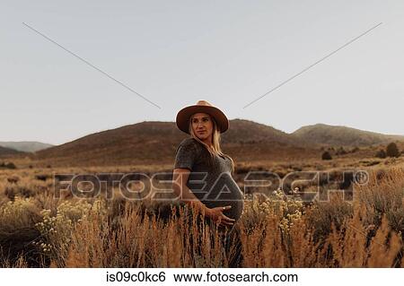 Pregnant woman in field landscape, Kennedy Meadows, California, US View Large Photo Image Stock Photograph - Pregnant woman in field landscape, Kennedy Meadows, California, US. Fotosearch