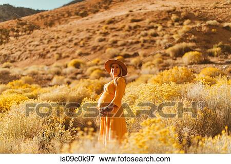 Pregnant woman walking in field landscape, Kennedy Meadows, California, US View Large Photo Image Stock Photo - Pregnant woman walking in field landscape, Kennedy Meadows, California, US. Fotosearch