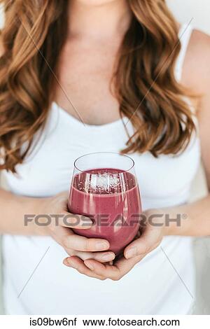 Pregnant woman with glass of smoothie View Large Photo Image Stock Image - Pregnant woman with glass of smoothie. Fotosearch