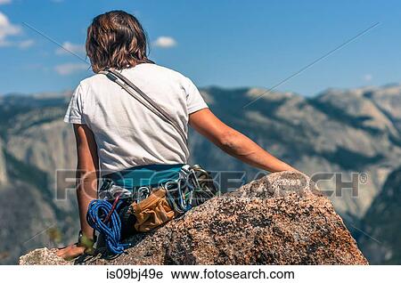 Rear view of rock climber on Higher Cathedral Spire looking away at view, Yosemite Valley, California, United States View Large Photo Image Stock Image - Rear view of rock climber on Higher Cathedral Spire looking away at view, Yosemite Valley, California, United States. Fotosearch
