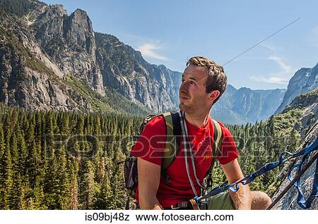 Rock climber, looking away at view, Yosemite National Park, United States View Large Photo Image Stock Photo - Rock climber, looking away at view, Yosemite National Park, United States. Fotosearch