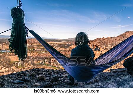 Rock climber on hammock on summit, Smith Rock State Park, Oregon, USA View Large Photo Image Stock Photograph - Rock climber on hammock on summit, Smith Rock State Park, Oregon, USA. Fotosearch