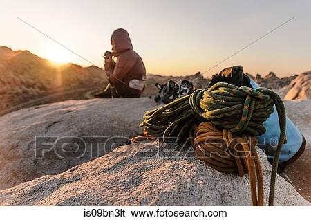 Rock climber on summit at sunset, Joshua Tree, California, USA View Large Photo Image Stock Photograph - Rock climber on summit at sunset, Joshua Tree, California, USA. Fotosearch