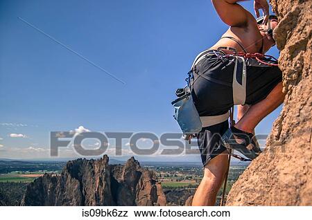 Rock climber rock climbing, Smith Rock State Park, Terrebonne, Oregon, United States View Large Photo Image Stock Photo - Rock climber rock climbing, Smith Rock State Park, Terrebonne, Oregon, United States. Fotosearch