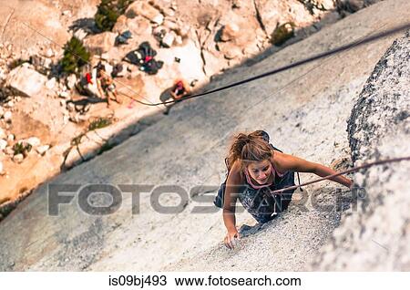 Rock climber rock climbing, Yosemite National Park, United States View Large Photo Image Stock Image - Rock climber rock climbing, Yosemite National Park, United States. Fotosearch