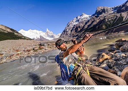 Rock climber sliding on rope over river, El Chaltn, south Patagonia, Argentina View Large Photo Image Stock Image - Rock climber sliding on rope over river, El Chaltn, south Patagonia, Argentina. Fotosearch
