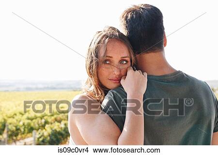 Picture - Romantic couple in vineyard, Cape Town, South Africa. Fotosearch