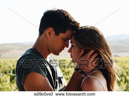 Stock Image - Romantic couple in vineyard, Cape Town, South Africa. Fotosearch