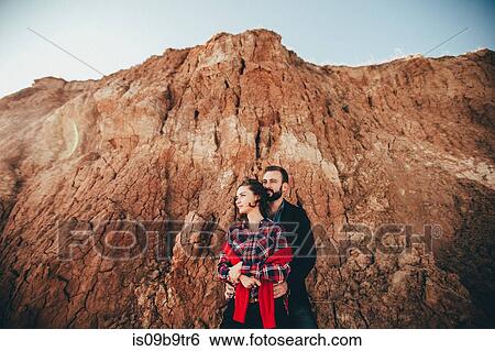 Romantic mid adult couple by beach cliff, Odessa Oblast, Ukraine View Large Photo Image Stock Photograph - Romantic mid adult couple by beach cliff, Odessa Oblast, Ukraine. Fotosearch
