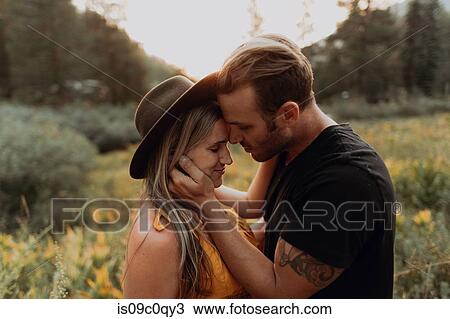 Stock Image - Romantic mid adult couple face to face in rural valley, Mineral King, California, USA. Fotosearch