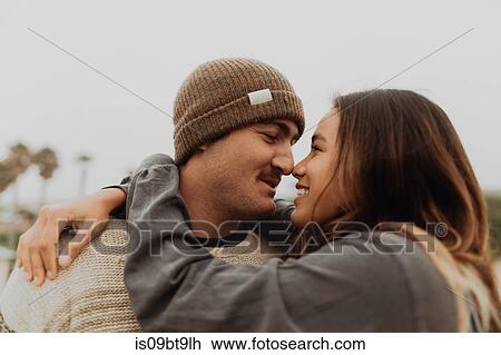 Romantic young couple face to face on beach, Jalama, California, USA View Large Photo Image Stock Image - Romantic young couple face to face on beach, Jalama, California, USA. Fotosearch