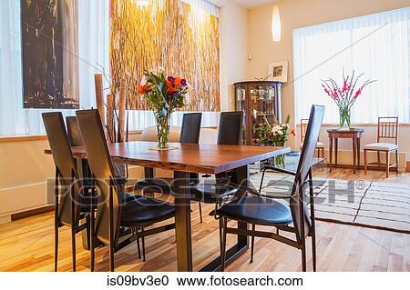 Rosewood table with black leather high back chairs in living room View Large Photo Image Stock Image - Rosewood table with black leather high back chairs in living room. Fotosearch