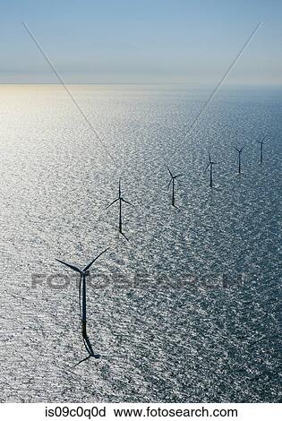 Row of wind turbines in offshore wind farm in the Borselle windfield, aerial view, Domburg, Zeeland, Netherlands View Large Photo Image Stock Image - Row of wind turbines in offshore wind farm in the Borselle windfield, aerial view, Domburg, Zeeland, Netherlands. Fotosearch