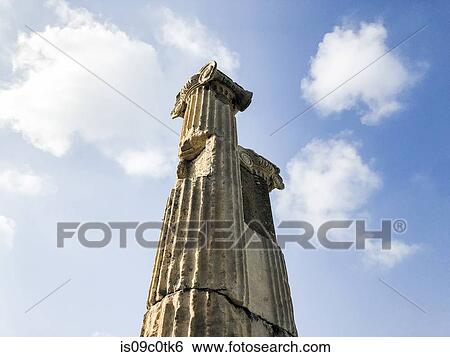 Ruins of ionic column against blue sky View Large Photo Image Stock Photograph - Ruins of ionic column against blue sky. Fotosearch