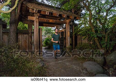 Runner going under entrance of park, North Vancouver, Canada View Large Photo Image Stock Photography - Runner going under entrance of park, North Vancouver, Canada. Fotosearch