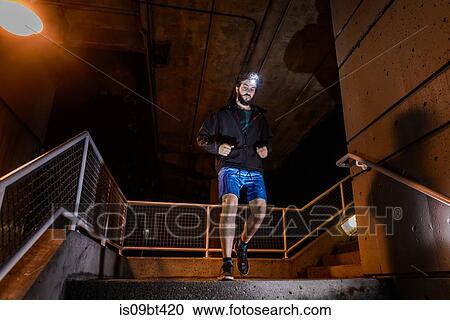 Runner with headlamp going down stairs, North Vancouver, Canada View Large Photo Image Stock Image - Runner with headlamp going down stairs, North Vancouver, Canada. Fotosearch