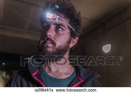 Runner with headlamp in tunnel View Large Photo Image Stock Photo - Runner with headlamp in tunnel. Fotosearch