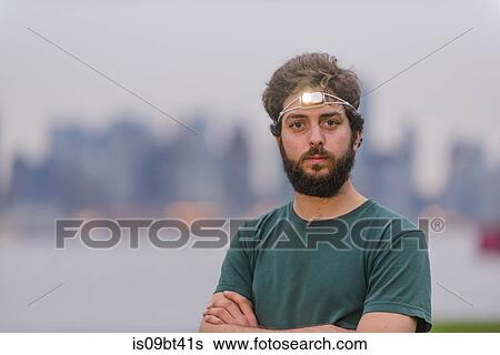 Runner with headlamp in urban area View Large Photo Image Stock Photograph - Runner with headlamp in urban area. Fotosearch