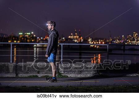 Runner with headlamp in urban North Vancouver, Canada View Large Photo Image Stock Photo - Runner with headlamp in urban North Vancouver, Canada. Fotosearch