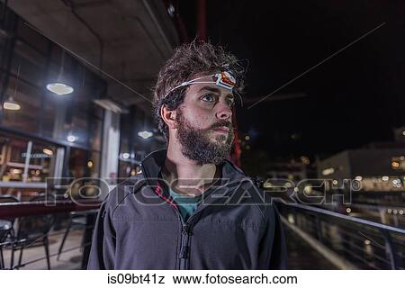 Runner with headlamp in urban North Vancouver, Canada View Large Photo Image Stock Photo - Runner with headlamp in urban North Vancouver, Canada. Fotosearch
