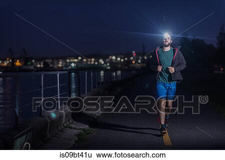 Runner with headlamp in urban North Vancouver, Canada View Large Photo Image Stock Photograph - Runner with headlamp in urban North Vancouver, Canada. Fotosearch