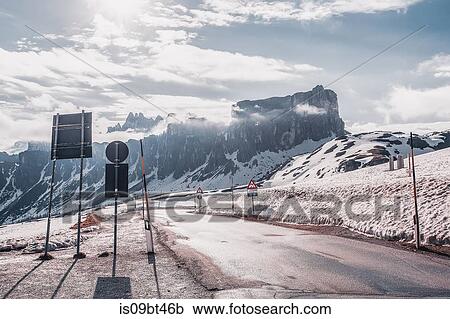 Rural road in snow capped mountains, Dolomites, Italy View Large Photo Image Stock Image - Rural road in snow capped mountains, Dolomites, Italy. Fotosearch