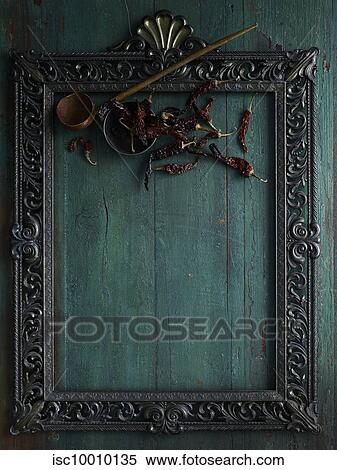 Rustic low key still life with dried chillies and bowl in picture frame, overhead view View Large Photo Image Stock Photography - Rustic low key still life with dried chillies and bowl in picture frame, overhead view. Fotosearch