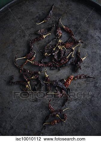 Rustic low key still life with scattered dried chillies, overhead view View Large Photo Image Stock Image - Rustic low key still life with scattered dried chillies, overhead view. Fotosearch