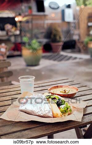 Salad wrap, potato chips and dip from food truck View Large Photo Image Stock Photography - Salad wrap, potato chips and dip from food truck. Fotosearch