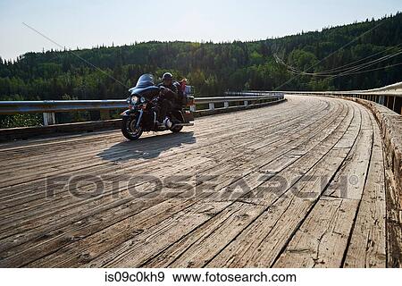 Senior male motorcyclist crossing Kiskatinaw Bridge, Dawson Creek, Canada View Large Photo Image Stock Photo - Senior male motorcyclist crossing Kiskatinaw Bridge, Dawson Creek, Canada. Fotosearch